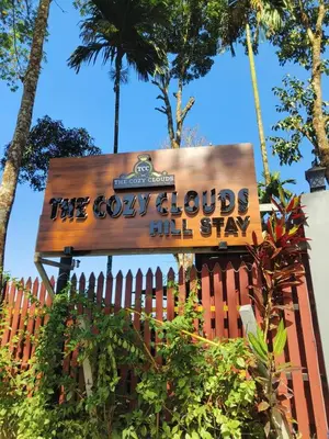 a wooden sign for the cowboys all stay at The Cozy Clouds Hill Stay in Napoklu