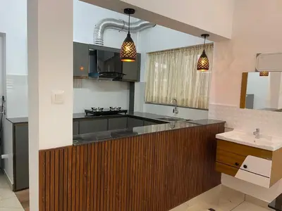 a kitchen with a sink and a counter top at RoyalGiri Apartment near Rajagiri Hospital in Alwaye