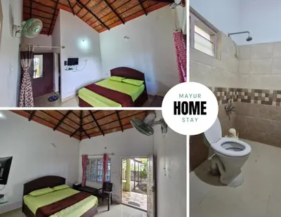 a room with two beds and a bathroom with a toilet at MAYUR Home Stay in Suntikoppa
