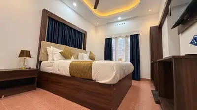 a bedroom with a large bed with a large window at Leafy Mist Villa in Munnar