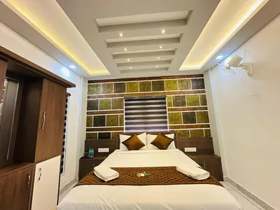 a bedroom with a bed and a brick wall at Crystal Winter Arcade wayanad in Wayanad