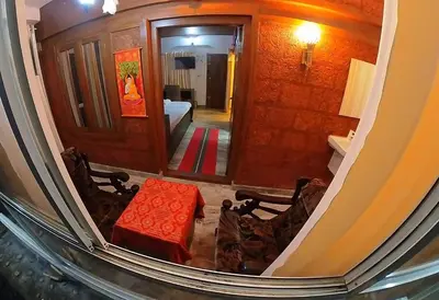 a view of a living room with a couch and a table at Entire Villa Homestay Rooms IRITTY in Irrity