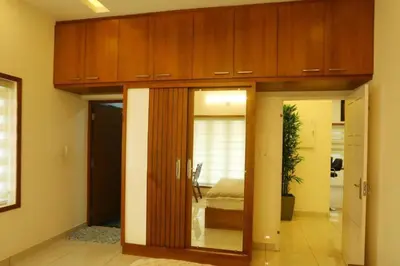 a bedroom with a bed in a room at Welcome to SP Luxury Bed Villa in Kāladi