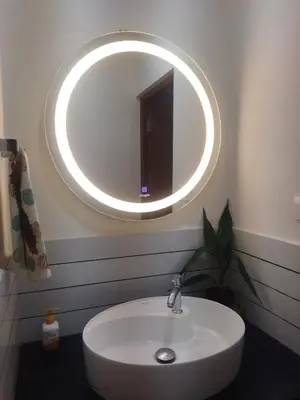 a bathroom with a sink and a mirror on the wall at Welcome to SP Luxury Bed Villa in Kāladi