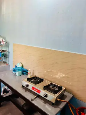 a stove sitting on a table in a room at Arapura Veedu Heritage Homestay in Kizhillam
