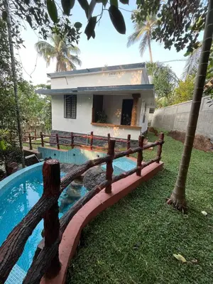 a house with a fence around a swimming pool at Dragster Pool Villa in Māla