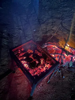 a glass table with red lights on the ground at LilliputHaven Treehut in Sultan Bathery