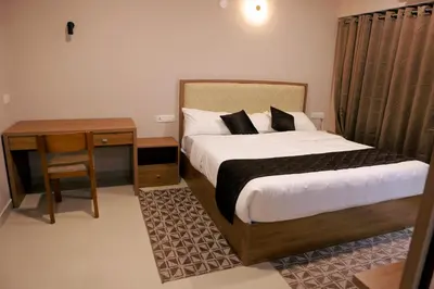 a bedroom with a bed and a nightstand and a bed sidx sidx at Luxairy in Chewarra