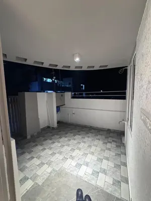 an empty room with a tile floor and a window at Vels Villa A home away from home at Pollachi in Pollāchi