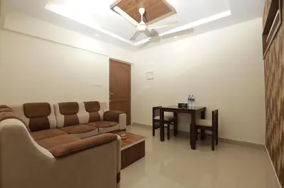 a living room with a couch and a table at Platinum Apartments in Chewarra