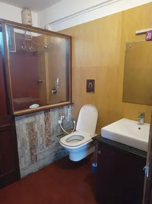 a bathroom with a toilet and a sink at Kadal boutique beach stay in Green Island