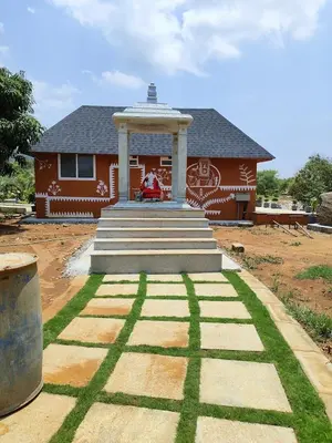 a house with a large stairway in front of it at V Nature Resorts in Kanakapura