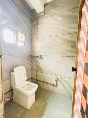 a small bathroom with a toilet and a window at Tea vista holiday home in Kalpetta