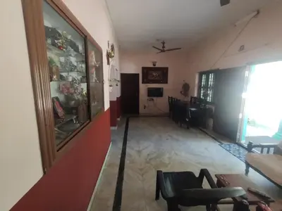 a hallway with a living room and a dining room at Katadi beach homestay in Trichūr