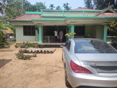a car parked in front of a house at Katadi beach homestay in Trichūr