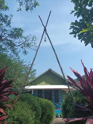 a cross in front of a building at VIHA The Heaven in Meppādi