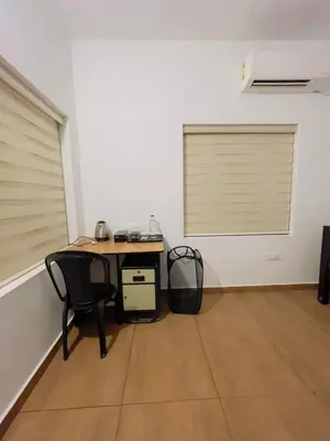 an office with a desk and a chair in a room at RiverSoul Villa in North Paravur