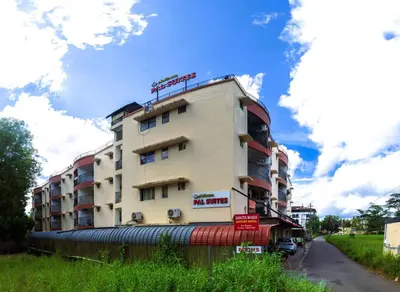 a tall building on the side of a road at Classic Cochin Airport Hotel in Nedumbassery
