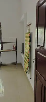 a room with a door and a towel on the wall at joys villa self service villa in Cherai Beach
