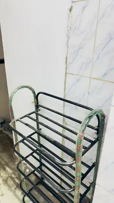 a metal bench chained to a wall at StayIn-SGH near Mysore palace in Mysore