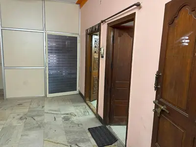 an empty room with two doors and a hallway at StayIn-SGH near Mysore palace in Mysore