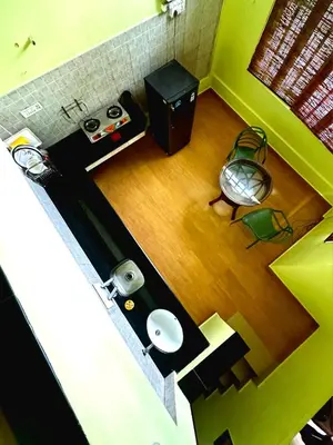an overhead view of a living room with a wooden floor at Hazel and Oak in Vythiri