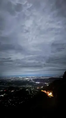a view of a city at night at Hazel and Oak in Vythiri