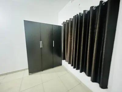 a row of black cabinets in a room at Sunrise Boutique Villa in Kozhikode