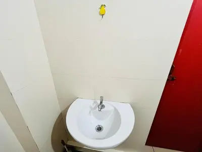 a bathroom with a white sink in a room at Sunrise Boutique Villa in Kozhikode