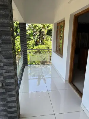 a hallway of a house with a glass floor at Safari Homestay, Malayattoor in Kodanad