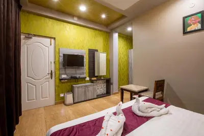 a bedroom with a bed with towels on it at Paradise Point Ooty in Ooty