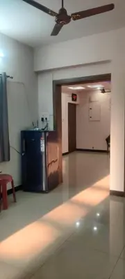an empty room with a refrigerator in a room with a ceiling at Regi's Adobe - Entire Place -Service Apartment for Rent in Coimbatore
