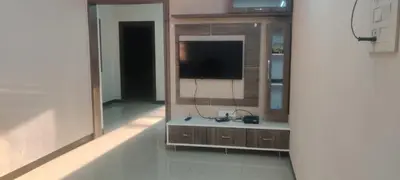 a room with a television in a building at Regi's Adobe - Entire Place -Service Apartment for Rent in Coimbatore