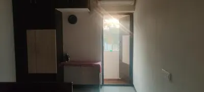 a hallway with a room with a table and a clock at Regi's Adobe - Entire Place -Service Apartment for Rent in Coimbatore
