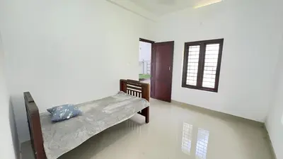 a bedroom with two bunk beds and a window at CozyHaven in Quilāndi