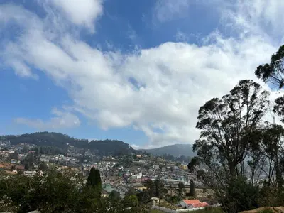 a view of a city from a hill at Crown Crest in Ooty