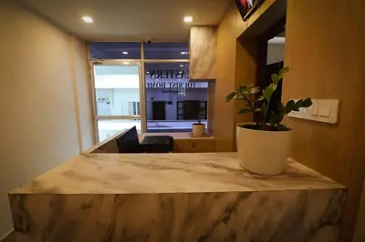 a potted plant sitting on a counter in an office at Hotel Eastern in Sultan Bathery