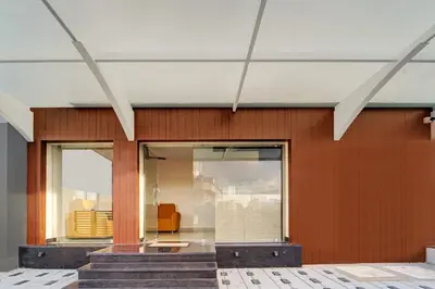 a lobby of a building with a glass door at Super Hotel O Vilankurichi in Coimbatore