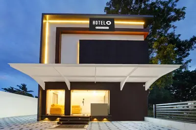 a building with a hilto sign on it at Super Hotel O Vilankurichi in Coimbatore