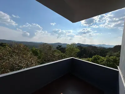 a balcony with a view of the mountains at Mountain View Villas in Madikeri