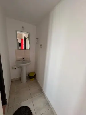 a bathroom with a sink and a toilet at Mountain View Villas in Madikeri