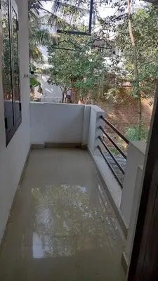 an empty room with a view of a balcony at Aswathy Bhavan Near Star auditorium vadakkenchery in Palakkad