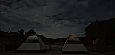 two white tents sitting next to each other at night at Gypsy habitat Backpackers Space in Wodapatti