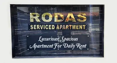 a sign for a roacus servicedagentsagentsagentagentagentsagentsagentsagents at Rodas Serviced Apartment in Coimbatore