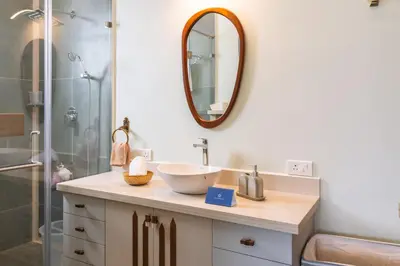 a bathroom with a sink and a shower at SaffronStays Coonoor Canvas in Coonoor