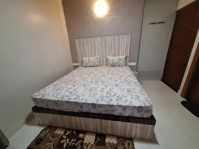 a bedroom with a bed in a room at Golden Gate Luxury Villas by LexStays in Ooty