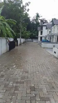 a cobblestone street in front of some buildings at Fully furnished 3BHK 2 Floor Villa in Angamali