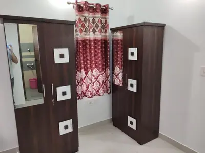 a room with two wooden cabinets and a mirror at Fully furnished 3BHK 2 Floor Villa in Angamali