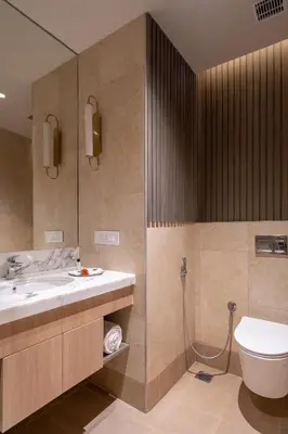 a bathroom with a sink and a toilet at The Magnus in Coimbatore