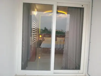 a window with a view of a bedroom at Dew Dreams Periyar Castle in Alwaye